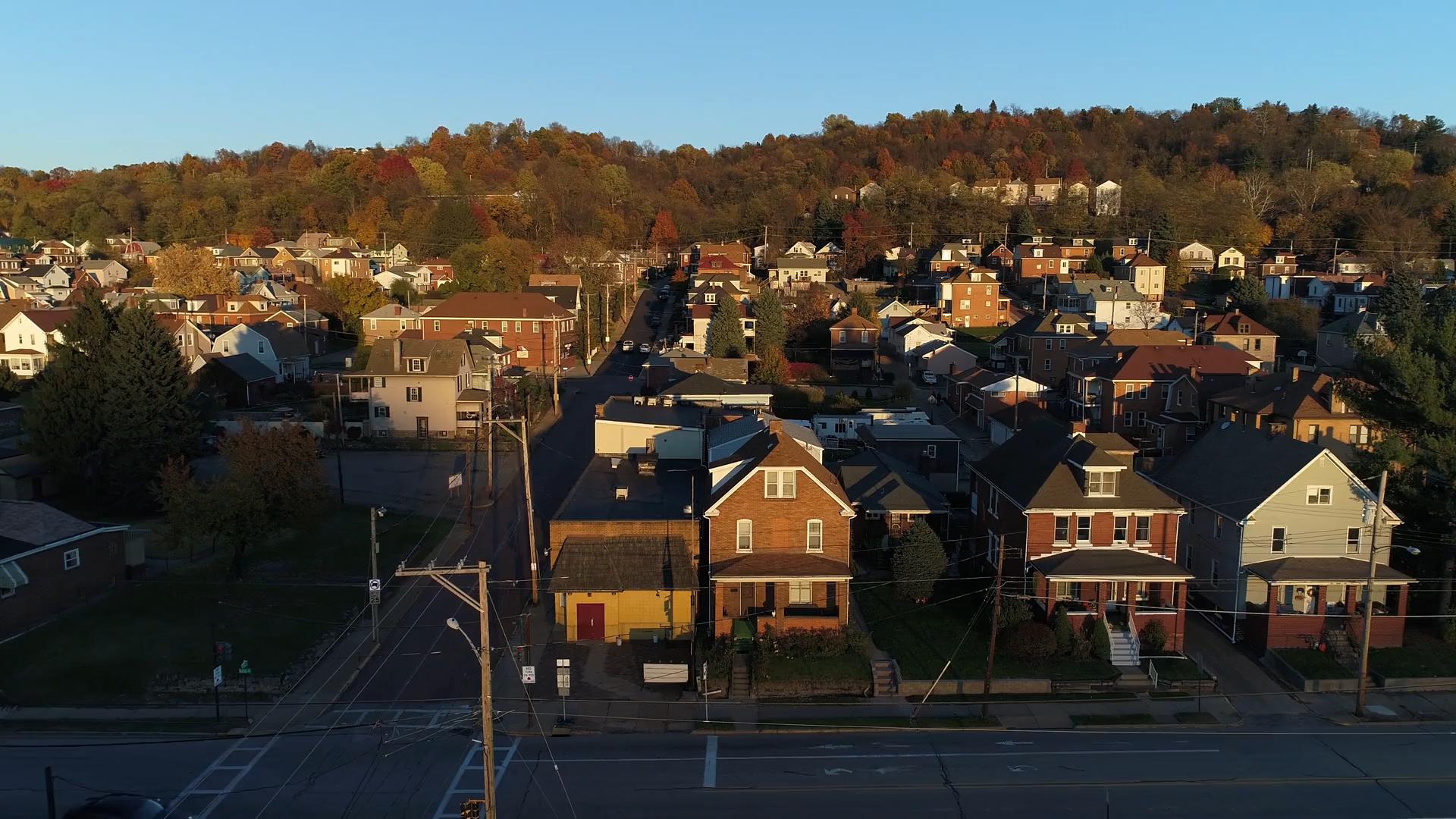 videoblocks-a-profile-moving-aerial-establishing-shot-of-a-typical-pennsylvania-small-town-at-sunset-pittsburgh-suburbs_btxzktz1f_1080__D_17.jpeg